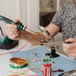 A Person Using a Soldering Iron